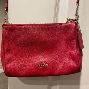Red coach pebbled leather bag.      Crossbody or shoulder bag with chain